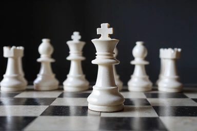 Chess pieces on a board, symbolizing strategic thinking
